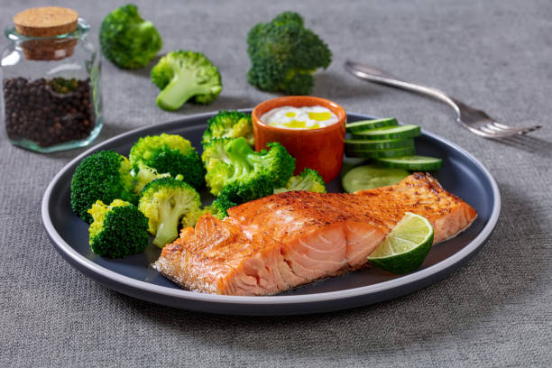 istock roast salmon fillet with boiled broccoli and sauce 1388319884