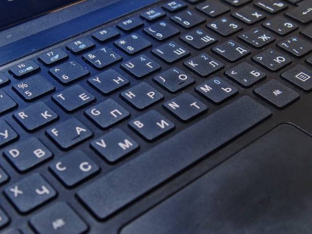istock English-Russian laptop keyboard layout in black close-up 1388320818