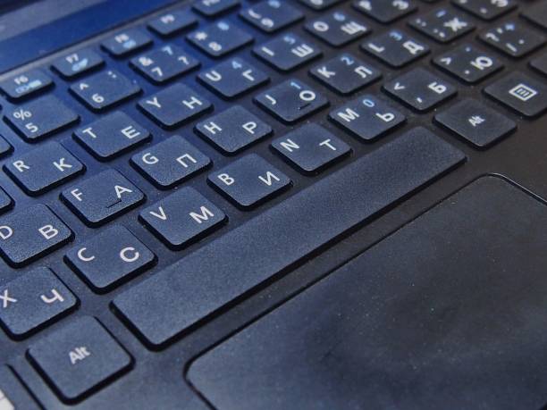 istock English-Russian laptop keyboard layout in black close-up 1388322923