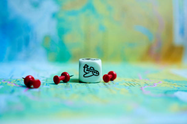 World map with a cube and a drawing of an airplane