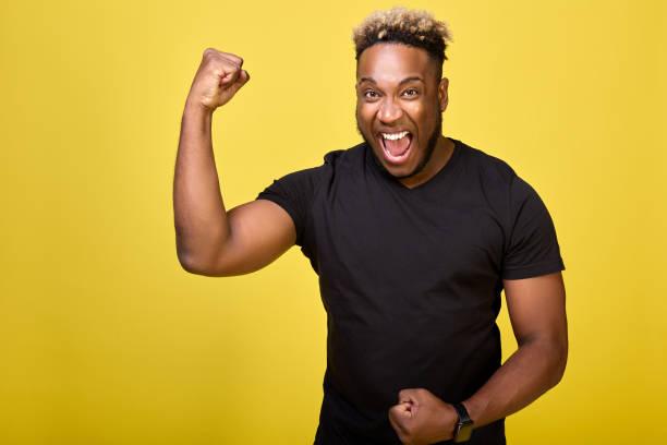 istock Athletic strong guy brags about his muscles in front of camera 1388331901
