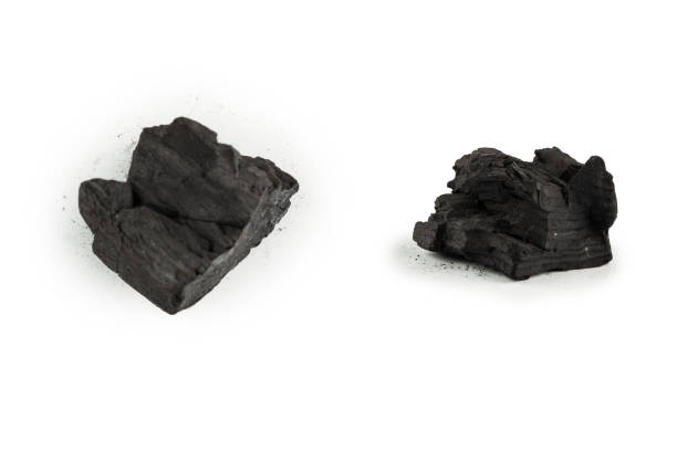 istock Black oak coal isolated on white background. 1388332169