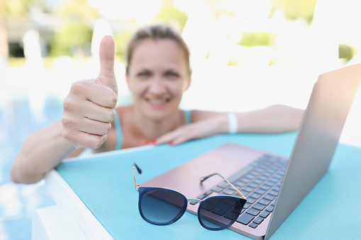 Portrait of happy joyful woman show thumbs up on camera, relaxed person on summer holiday, needed relaxation. Chill, leisure, fun, vacation, trip concept