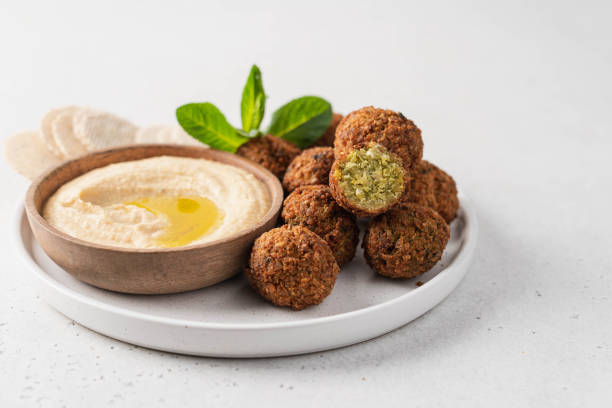 istock Bowl of fried falafel and hummus dip 1388333484