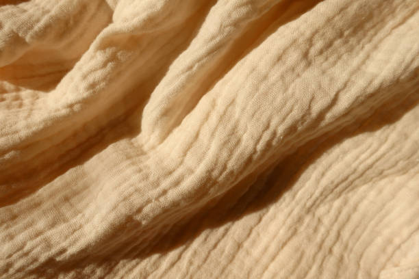 istock Rippled thin pastel beige cotton muslin fabric 1388333746