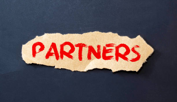 istock PARTNER word made with building wooden blocks on light background. 1388335021