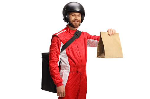 Motorist delivering food in a paper bag isolated on white background