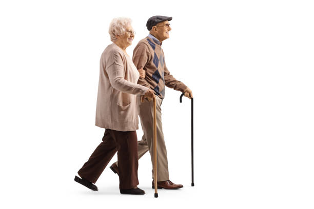 istock Elderly man and woman walking together with canes 1388337701