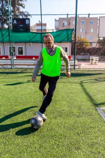 istock Senior men playing football 1388338442