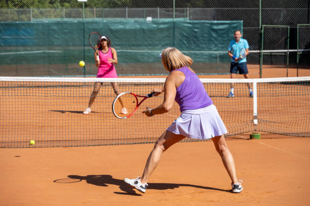 istock Senior player playing tennis 1388338520