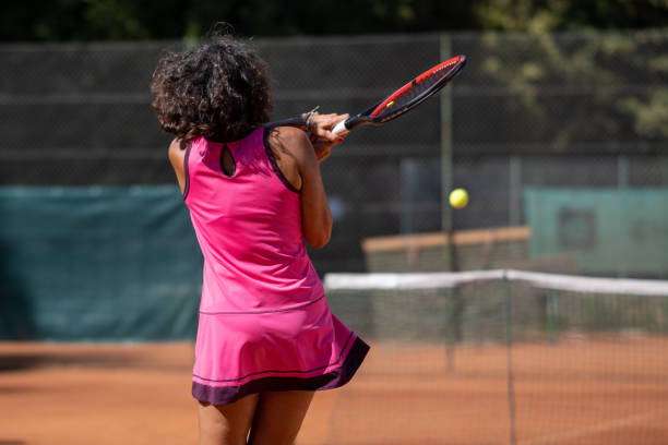 istock Woman playing tennis 1388338552