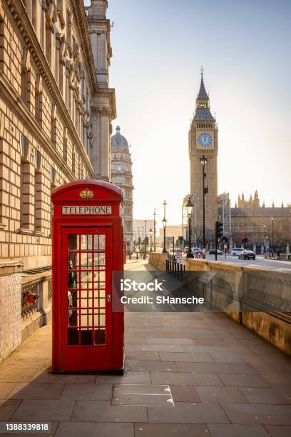 A Classic Red Telephone Booth In Front Of The Big Ben Clocktower In London Stock Photo - Download Image Now