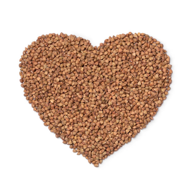 istock Kasha, roasted buckwheat, in heart shape isolated on white background 1388340952
