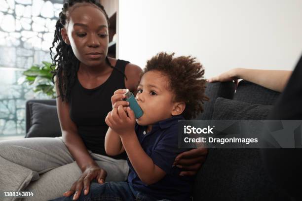 Toddler Boy Using Inhaler Stock Photo - Download Image Now - Asthma Inhaler, Child, Mother