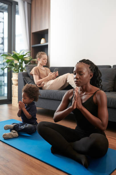 istock Mother and Toddler Son Meditating 1388343867