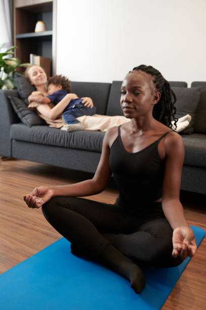 Woman Meditating on Yoga Mat