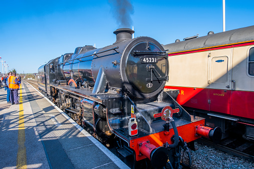 Nova Gorica, Slovenia - December 01, 2019: Christmas steam train on the railway station of Nova Gorica, Slovenia, lots of black and gray steam