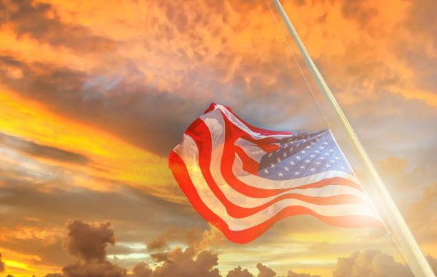 istock American flags with sunset on background 1388345418