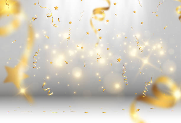 istock Golden confetti falls on a beautiful background. Falling streamers on stage. 1388348378