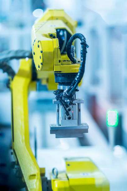 istock Automatic industrial robotic robot working, industry 4.0 and technology concept 1388348668