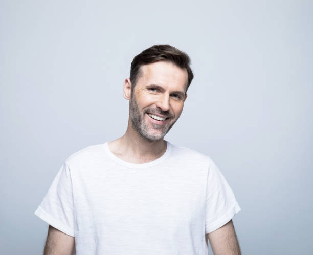 istock Smiling handsome man with hair stubble 1388349808