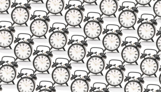 istock repeating vintage alarm clocks in flat lay style. 1388349835
