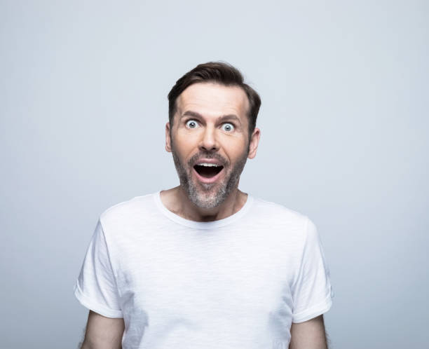 istock Surprised handsome man with mouth open 1388349861