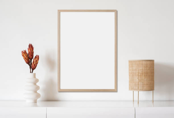 istock Artwork mock-up in interior design. Blank portrait orientation picture frame on a wall 1388350077
