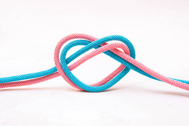 istock Heart shape made of two colored cords on gray 1388351127
