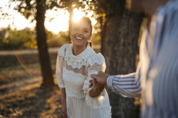 istock Romantic young couple dancing in nature at sunset 1388351585