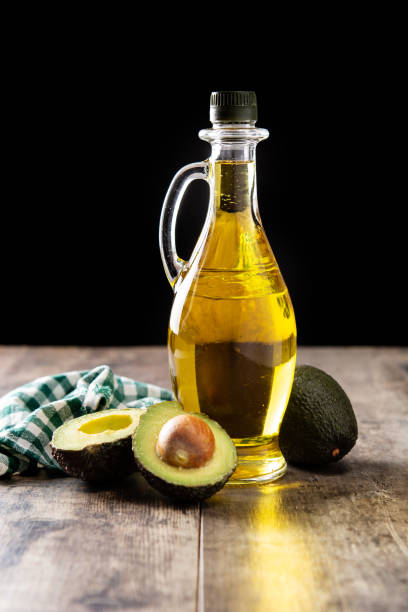 oil and ripe fresh avocado - avocado oil bildbanksfoton och bilder