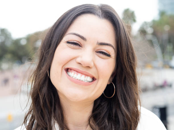 istock Smiling young spanish woman looking at camera. Positive emotions. 1388353380