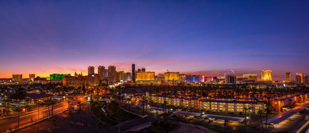 Skyline of the Casinos and Hotels of Las Vegas Strip Huge panorama picture of the Las Vegas Strip in Nevada at sunrise. Las Vegas is the 26th-most populous city in the United States, the most populous city in the state of Nevada, and the county seat of Clark County. The city anchors the Las Vegas Valley metropolitan area and is the largest city within the greater Mojave Desert. The city bills itself as The Entertainment Capital of the World, and is famous for its mega casino-hotels and associated activities. the strip las vegas stock pictures, royalty-free photos & images