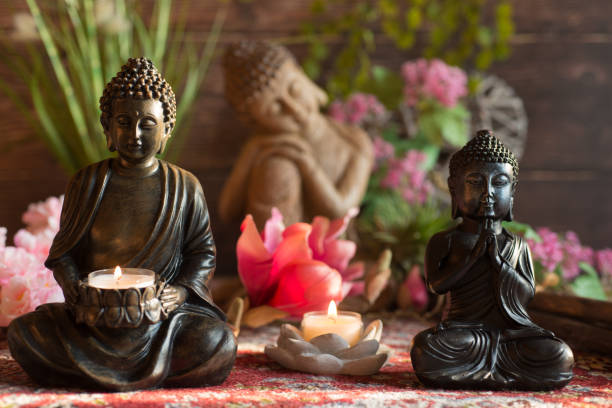istock Buddha in the ambience with candlelight and atmospheric lighting 1388354397
