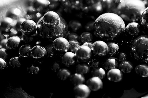 Magnetic ball bearings in close up for use as an abstract background.