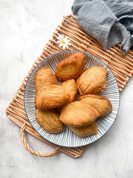 Spiral Curry Puff  (Karipap Pusing) Malaysian favorites snack spiral curry puffs or locally known as Karipap Pusing. traditional malaysian food stock pictures, royalty-free photos & images