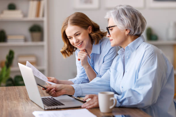 istock Businesswomen working together on project 1388356309