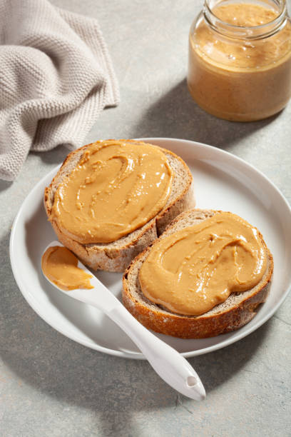 istock smooth peanut butter bread toast, healthy traditional sandwich 1388357194