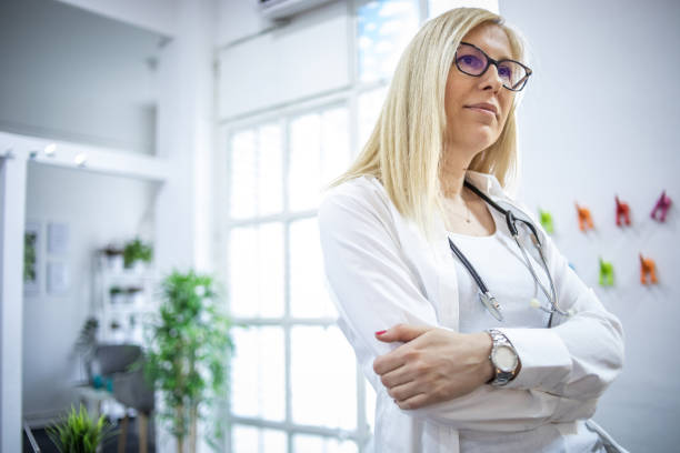 istock Portrait of a doctor standing with folded arms 1388357623