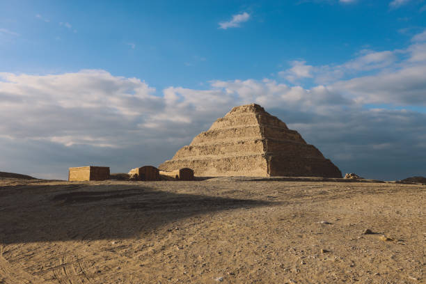 majestic view to the step pyramid of djoser under blue sky, is an archaeological site in the saqqara necropolis, northwest of the city of memphis - the step pyramid of zoser imagens e fotografias de stock