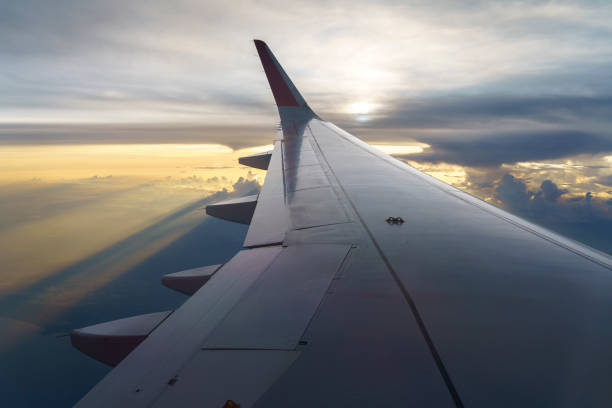 istock Sunset sky on airplane window over Phuket, Thailand 1388358510