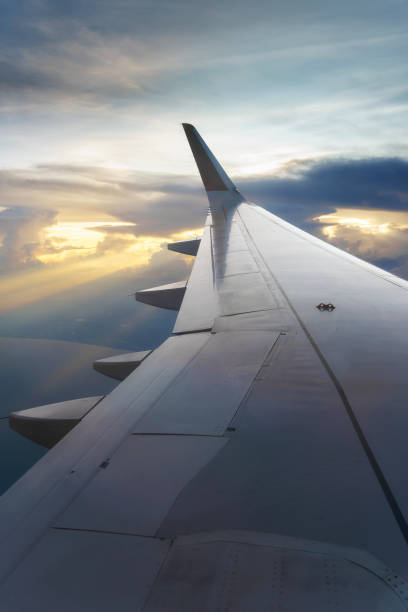 istock Sunset sky on airplane window over Phuket, Thailand 1388358521