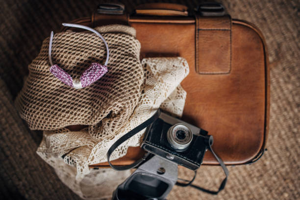 Female personal accessories on a suitcase.