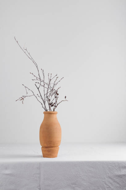 istock Clay vase with bunches on a table 1388358787