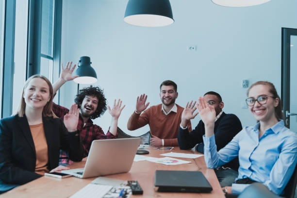 istock Young people raising hand to ask question at team training, curious black employee or conference seminar participant vote as volunteer at group office meeting with multiracial diverse businesspeople 1388360129
