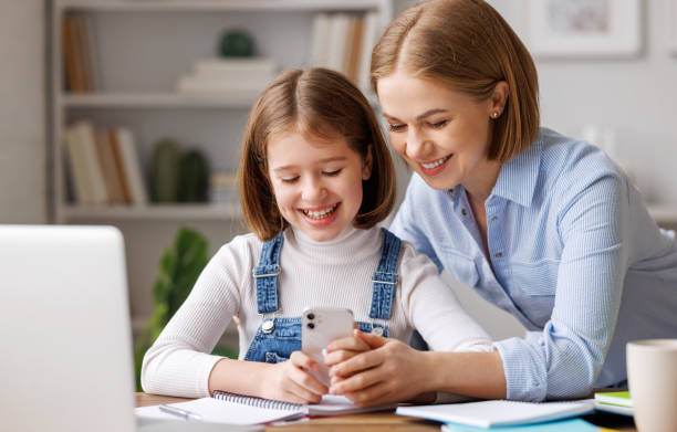 istock Mother and daughter doing homework together 1388360897