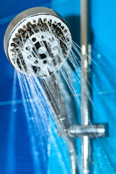 istock Dirty unhygienic showerhead in bathroom 1388361591