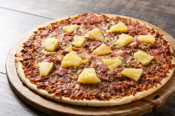 istock Hawaiian pizza with pineapple,ham and cheese 1388363216