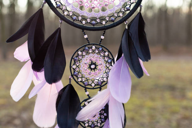 istock Handmade dream catcher with feathers threads and beads rope hanging 1388363470