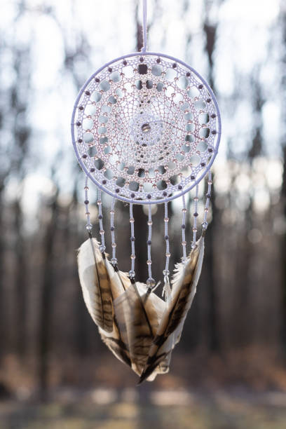istock Handmade dream catcher with feathers threads and beads rope hanging 1388363472